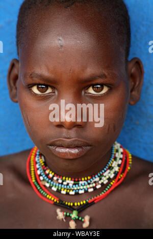 Tribal Hamer boy cattle herder in Turmi, Lower Omo Valley, Ethiopia Stock Photo