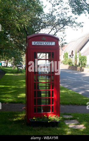 A traditional red telephone box in Gawcott village, Buckinghamshire, England, UK Stock Photo