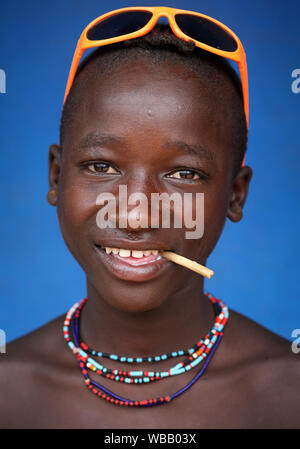 Tribal Hamer boy cattle herder in Turmi, Lower Omo Valley, Ethiopia Stock Photo