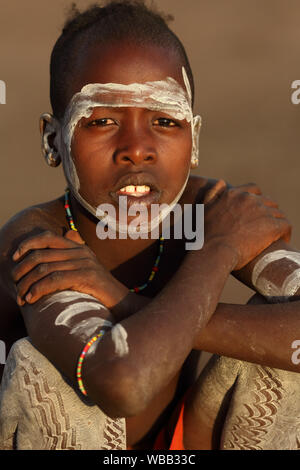 Tribal Hamer boy cattle herder in Turmi, Lower Omo Valley, Ethiopia Stock Photo