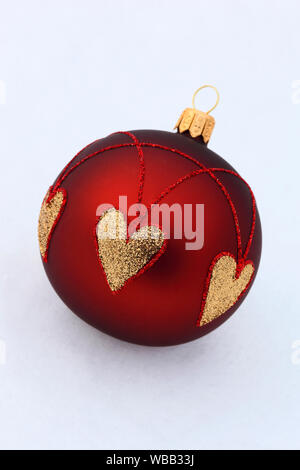 Christmas bauble in red and gold. Studio picture against a white background. Switzerland Stock Photo