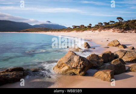 Sunny morning at the beach of the wineglass-bay, Tasmania Australia, smooth water Stock Photo