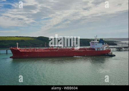 Oil and petro-chemical tankers moored to pontoons serving Milford Haven refineries in South Wales.