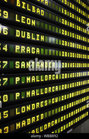 Departure schedule at an airport in Spain. Flights to Bilbao, Leon, Dublin, Prague, Santander, Mallorca, London and Madrid. Stock Photo