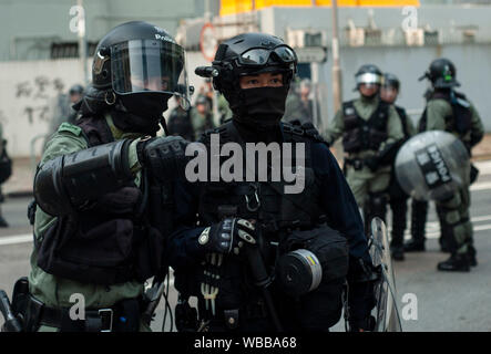 Hong Kong, China. 24th Aug, 2019. Riot police officers gather information in preparation to charge a large mass of pro-democracy protesters during the demonstration.Mass demonstrations continues for one more weekend in Hong Kong which began in June 2019 over a now-suspended extradition bill to China. Credit: SOPA Images Limited/Alamy Live News Stock Photo