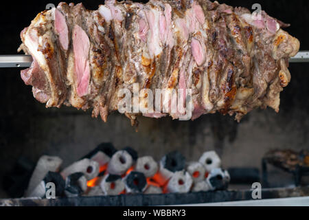 Traditional Turkish Oltu Cag Crochet Shish Kebab doner grilled in wood fired oven. Famous yatik doner kebab from Erzurum cuisine in restaurant Stock Photo