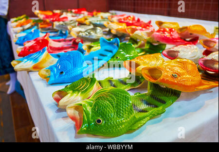 the counter of chiang mai night market stall with colorful unusual fish rubber slippers thailand wbbyym