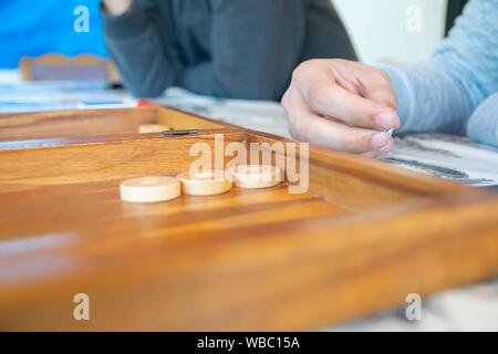 Man holding dice in hand Stock Photo