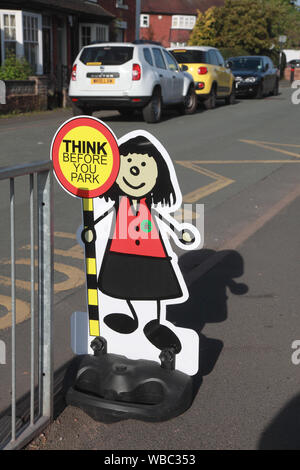 A sign outside an infants’ school to try to persuade parents to think before they park and to park in a safe place Stock Photo