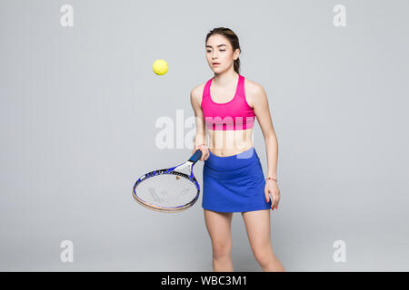 Woman with tennis racket and ball on light grey background, closeup Stock Photo