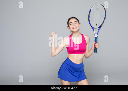 Isolated Female tennis player rejoices in victory on white background Stock Photo