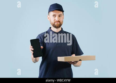 Courier is delivering pizza, holding smart phone in a hand for customer to sign Stock Photo