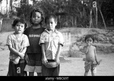 Sengkol, Lombok, Indonesia - September 20, 2017: four preschool aged children posing in rural Indonesian village Stock Photo