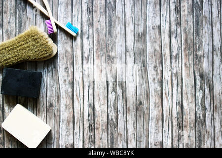 zero waste hygiene products on wooden background with copy space. Earthy tones, zero waste and plastic free concept Stock Photo