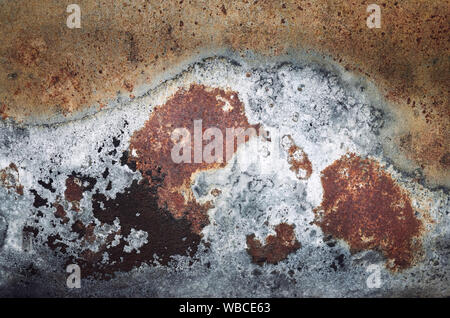 Porous rusty sheet surface, grunge background or texture. Stock Photo
