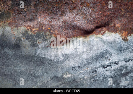 Porous rusty sheet surface, grunge background or texture. Stock Photo