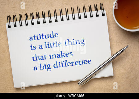 Attitude is a little thing that makes a big difference - inspirational handwriting in a sketchbook with a cup of tea Stock Photo