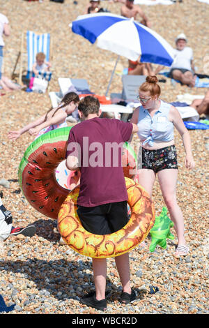 Brighton, UK. 26 August 2019.  Brighton beach is packed on August Bank Holiday Monday in hot sunshine as temperatures soar into the high twenties again . Yesterday saw record temperatures being set for an August bank holiday in West London . Credit : Simon Dack / Alamy Live News Stock Photo