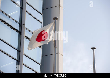 Chiba, Japan, 08/26/2019 , Japanese flag in front of the Kenkeisatsuhonbu, the Chiba prefectural police headquarters, Stock Photo