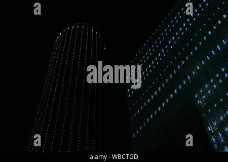 lights in the dark - night illumination of buildings on a black background Stock Photo