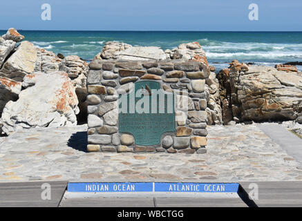 plaque at southernmost point of Africa against Atlantic Ocean and Indian Ocean at Cape Agulhas on sunny day Stock Photo