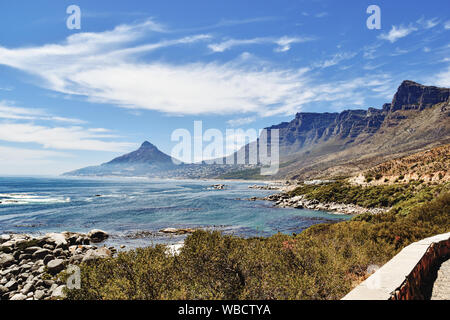 Camps Bay and Twelve Apostles against blue ocean and sky on sunny day, seen from Oudekraal Stock Photo