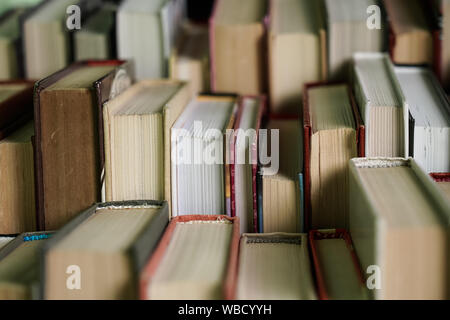 Stack of books background. many books piles. Stock Photo
