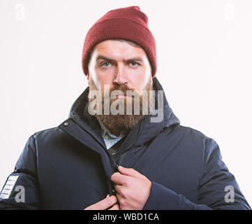 Hipster modern fashion. Guy wear hat and black winter jacket. Hipster style  menswear. Hipster outfit. Stylish and comfortable. Man bearded hipster  posing confidently in warm black jacket or parka Stock Photo 