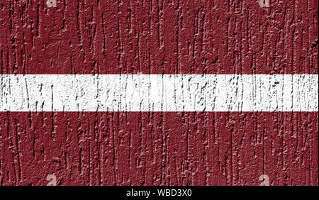 Flag of Latvia close up painted on a cracked wall Stock Photo