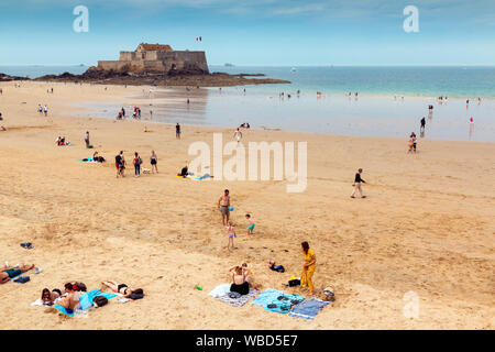 Saint Malo, Brittany, France - June 23, 2019: Grande Plage du Sillon beach in Saint Malo with a people relaxing on a hot summer day Stock Photo