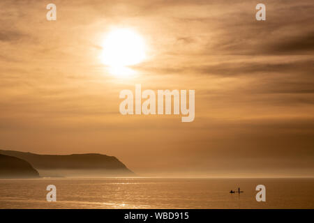 Paddle boarders at Llandudno West Shore, North Wales coast Stock Photo