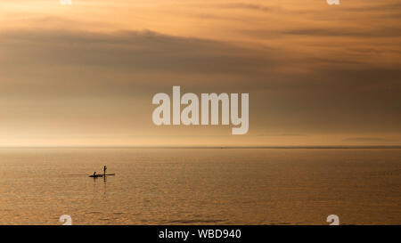 Paddle boarders at Llandudno West Shore, North Wales coast Stock Photo