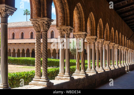 Decorated columns and capitals in the Chiostro dei Benedettini, cloisters, in the cathedral complex at Monreale near Palermo, Sicily, Italy. Stock Photo