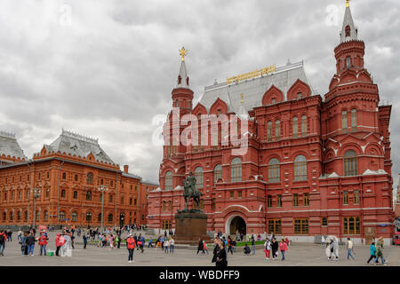 MOSCOW, RUSSIA - AUGUST 1, 2019: Facade of State Historical Museum in Moscow with tourists walking around, located in the Red Square is one major attr Stock Photo