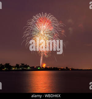 Happy 4th of July - Colorful fireworks show for celebrating U.S. Independence Day at Marston Lake, Denver, Colorado, USA.