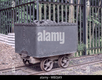 Old mine cart, used for transporting coal from the mine. Stock Photo