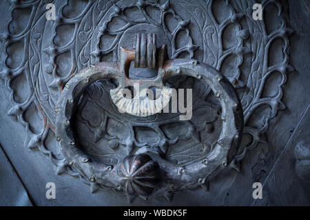 old rusty door knocker on door Stock Photo
