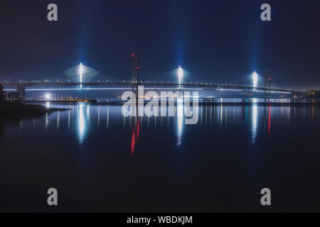 Night view of two bridges over the sea bay, Forth Road Bridge and Queensferry Crossing, Scotland, United Kingdom Stock Photo