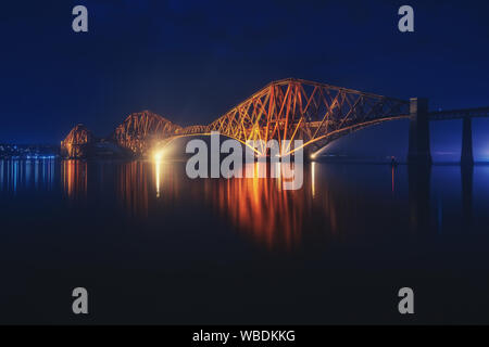 Night view of Forth Rail Bridge, the worlds longest cantilever bridge. August 2019. Scotland, United Kingdom Stock Photo