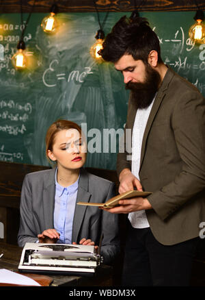 Students are communicating on regular basis with the tutor. University male speaker conducts business training. Awesome teachers know about things tha Stock Photo