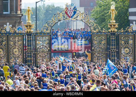 Warrington, UK. 26th Aug, 2019. Warrington bring the Coral Challlenge Cup back home - the open-top bus travels past the Golden Gates of the Town Hall Credit: John Hopkins/Alamy Live News Stock Photo