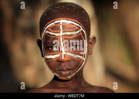 Young tribal Suri boy at a ceremony in Lower Omo Valley near Kibish, Ethiopia Stock Photo