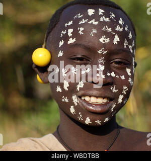 Young tribal Suri boy at a ceremony in Lower Omo Valley near Kibish, Ethiopia Stock Photo