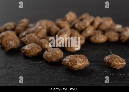 Lot of whole chocolate ball breakfast cereals on grey stone Stock Photo