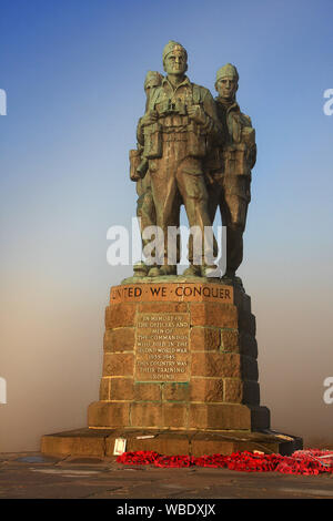 The plinth of the memorial records the Commando's motto 'United We Conquer', and a plaque states: 'In Memory of the Officers and men of the Commandos Stock Photo