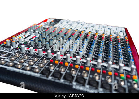Close up photo of a professional sound mixer with many adjustments, knob switches and buttons of audio mixer control panel. Stock Photo