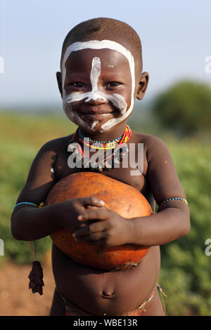 Tribal Hamer boy cattle herder in Turmi, Lower Omo Valley, Ethiopia Stock Photo