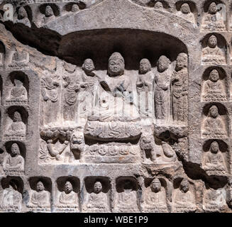 Detail from a carved stone Thousand Buddha stele, Northern Zhou dynasty (557-581 AD)