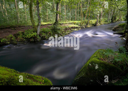 The River Washburn in North Yorkshire showing a large quantity of fast flowing water due to water being released from Thruscross reservoir Stock Photo