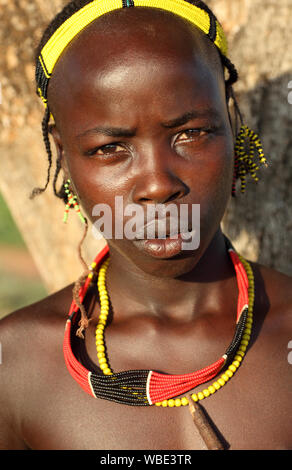 Tribal Hamer boy cattle herder in Turmi, Lower Omo Valley, Ethiopia Stock Photo